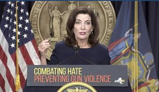 In this file image taken from video, New York Gov. Kathy Hochul shows bullets similar those used in the the Buffalo supermarket shooting, during a news conference, Wednesday, May 18, 2022, in New York. In light of the Buffalo shooting and the May 24 school shooting in Uvalde, Texas, Ms. Hochul said she would like to raise the minimum purchase age for long guns from 18 to 21.  (Office of the Governor of New York via AP)  **FILE**