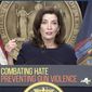 In this file image taken from video, New York Gov. Kathy Hochul shows bullets similar those used in the the Buffalo supermarket shooting, during a news conference, Wednesday, May 18, 2022, in New York. In light of the Buffalo shooting and the May 24 school shooting in Uvalde, Texas, Ms. Hochul said she would like to raise the minimum purchase age for long guns from 18 to 21.  (Office of the Governor of New York via AP)  **FILE**