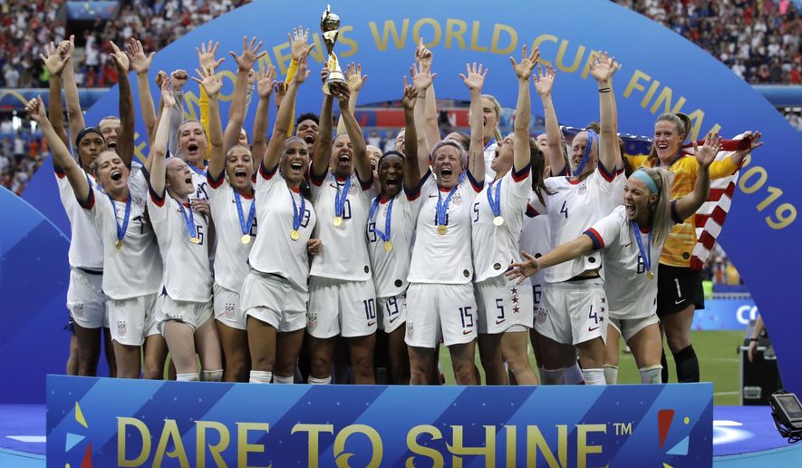 The United States&#39; team celebrates with the trophy after winning the Women&#39;s World Cup final soccer match against The Netherlands at the Stade de Lyon in Decines, outside Lyon, France, July 7, 2019. The U.S. Soccer Federation agreed to landmark collective bargaining agreements with its men&#39;s and women&#39;s teams, equalizing compensation for the first time.The CBAs announced Wednesday, May 18, 2022, run through 2028. The USSF is the first national governing body to promise both sexes matching money. (AP Photo/Alessandra Tarantino, File)