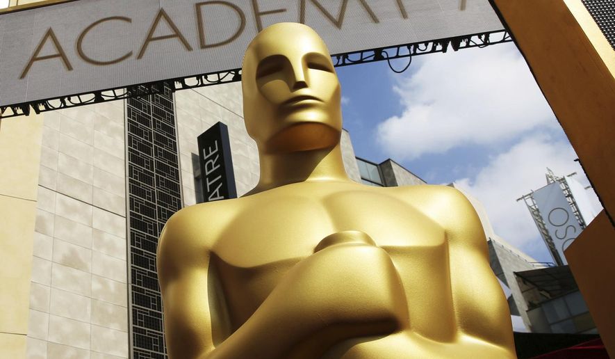 An Oscar statue appears outside the Dolby Theatre for the 87th Academy Awards in Los Angeles on Feb. 21, 2015. (Photo by Matt Sayles/Invision/AP, File)