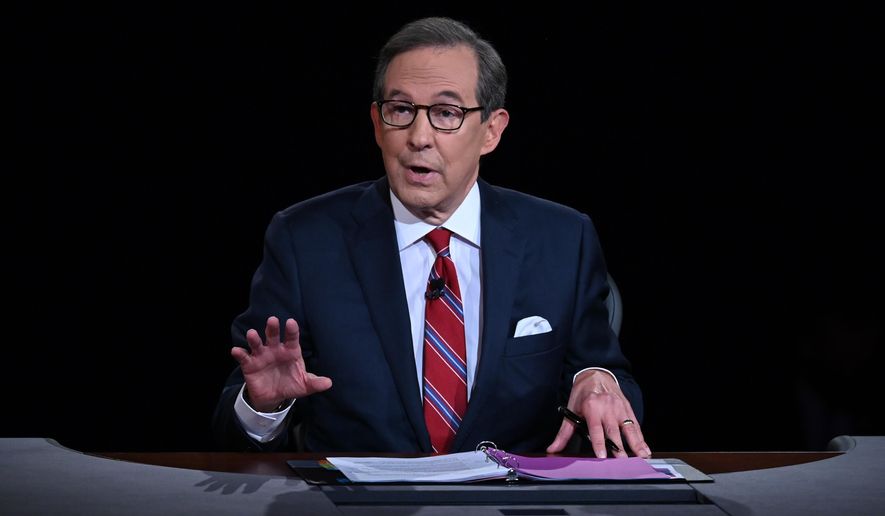 Moderator Chris Wallace of Fox News speaks as President Donald Trump and Democratic presidential candidate former Vice President Joe Biden participate in the first presidential debate in Cleveland on Sept. 29, 2020. Wallace will host a Sunday night interview show for CNN starting this fall. (Olivier Douliery/Pool via AP, File)