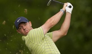 Rory McIlroy, of North Ireland, watches his tee shot on the 11th hole during the first round of the PGA Championship golf tournament, Thursday, May 19, 2022, in Tulsa, Okla. (AP Photo/Matt York)