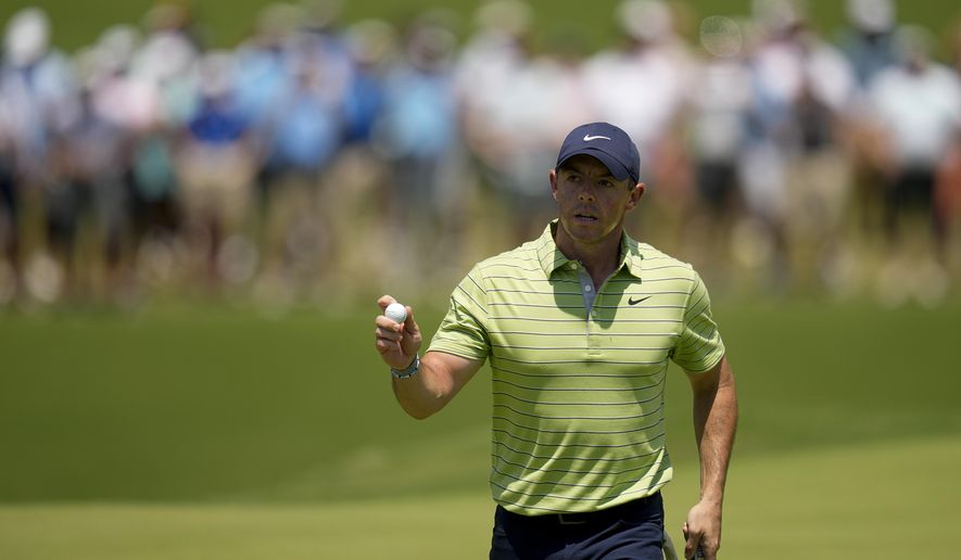Rory McIlroy, of North Ireland, waves after making a putt on the first hole during the first round of the PGA Championship golf tournament, Thursday, May 19, 2022, in Tulsa, Okla. (AP Photo/Sue Ogrocki)