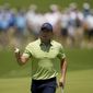 Rory McIlroy, of North Ireland, waves after making a putt on the first hole during the first round of the PGA Championship golf tournament, Thursday, May 19, 2022, in Tulsa, Okla. (AP Photo/Sue Ogrocki)