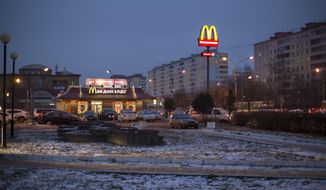 McDonald&#39;s restaurant is seen in the center of Dmitrov, a Russian town 75 km., (47 miles) north from Moscow, Russia, on Dec. 6, 2014. McDonald’s says it&#39;s started the process of selling its Russian business, which includes 850 restaurants that employ 62,000 people. The fast food giant pointed to the humanitarian crisis caused by the war, saying holding on to its business in Russia “is no longer tenable, nor is it consistent with McDonald’s values.” The Chicago-based company had temporarily closed its stores in Russia but was still paying employees.  (AP Photo/FILE)