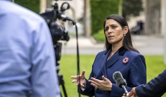 Britain&#39;s Home Secretary Priti Patel speaks during an interview with the Associated Press at the European headquarters of the United Nations in Geneva, Switzerland, Thursday, May 19, 2022. (Martial Trezzini/Keystone via AP)