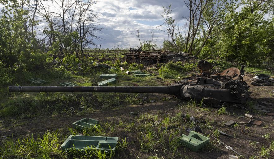 FILE - A destroyed tank near the village of Malaya Rohan, Kharkiv region, Ukraine, Monday, May 16, 2022. Twitter is stepping up its fight against misinformation with a new policy cracking down on posts that spread potentially dangerous false stories. Under the new rules, which take effect Thursday, May 19, 2022, Twitter will no longer automatically recommend posts that mischaracterize conditions during a conflict or make misleading claims about war crimes or atrocities. (AP Photo/Bernat Armangue, File)