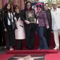 Ozzy Osbourne, center, poses with his family, from left, daughter Aimee, wife Sharon, daughter Kelly, son Jack and his son Louis, after he was honored with a star on the Hollywood Walk of Fame in Los Angeles on April 12, 2002. Aimee and her producer escaped a Hollywood recording studio fire that killed another person. Her mother, Sharon, confirms in an Instagram post that her elder daughter was one of two people who got out alive.  (AP Photo/Nick Ut, File)