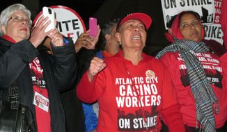 Striking union members protest outside the Trump Taj Mahal casino in Atlantic City N.J. as it shut down on Oct. 10, 2016. On May 20, 2022, the union launched a web site warning casino customers that &amp;quot;labor disputes&amp;quot; could happen if the casinos don&#39;t reach new contracts by the May 31 deadline. (AP Photo/Wayne Parry)