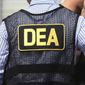 This June 13, 2016, file photo shows Drug Enforcement Administration agents in Florida.  A current U.S. Drug Enforcement Administration agent and a former supervisor in the agency were indicted Friday, May 20, 2022 on federal charges accusing them of leaking confidential law enforcement information to defense lawyers in Florida in exchange for cash and gifts. (Joe Burbank/Orlando Sentinel via AP)