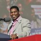 Republican U.S. Senate candidate Herschel Walker speaks during a Donald Trump rally for Georgia GOP candidates in Commerce, Ga., March 26, 2022. Walker boasts of his charity work helping members of the military who struggle with mental health. The football legend and leading Republican Senate candidate in Georgia says the outreach is done through a program he created, called Patriot Support. But court filings and company documents offer a more complicated picture. (Hyosub Shin/Atlanta Journal-Constitution via AP, File)
