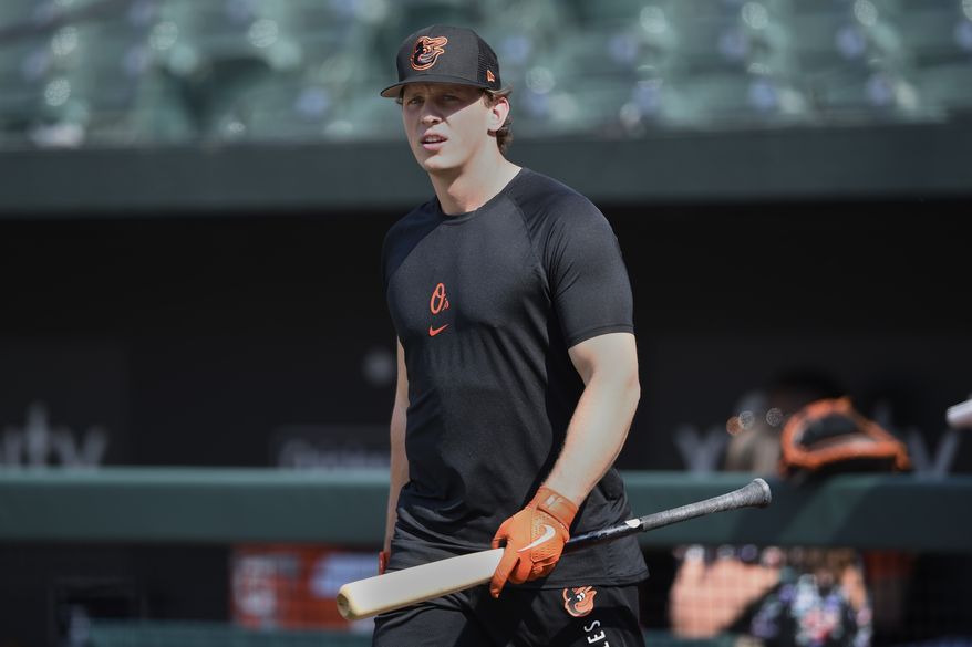 Baltimore Orioles Adley Rutschman awaits batting practice in his major league debut against the Tampa Bay Rays in a baseball game Saturday, May 21, 2022, in Baltimore. (AP Photo/Gail Burton)