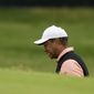 Tiger Woods grimaces on the 18th hole during the third round of the PGA Championship golf tournament at Southern Hills Country Club, Saturday, May 21, 2022, in Tulsa, Okla. (AP Photo/Matt York) **FILE**