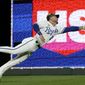 Kansas City Royals center fielder Kyle Isbel can&#39;t catch a two-run double hit by Minnesota Twins&#39; Jose Miranda during the eighth inning of a baseball game Friday, May 20, 2022, in Kansas City, Mo. (AP Photo/Charlie Riedel)