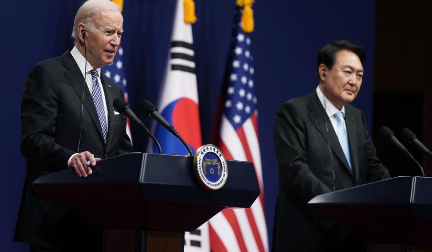 U.S. President Joe Biden, left, speaks as South Korean President Yoon Suk Yeol listens during a news conference at the People&#x27;s House inside the Ministry of National Defense, Saturday, May 21, 2022, in Seoul, South Korea. (AP Photo/Evan Vucci)