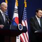 U.S. President Joe Biden, left, speaks as South Korean President Yoon Suk Yeol listens during a news conference at the People&#x27;s House inside the Ministry of National Defense, Saturday, May 21, 2022, in Seoul, South Korea. (AP Photo/Evan Vucci)