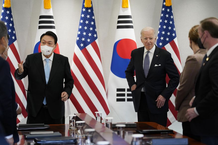 U.S. President Joe Biden, right, speaks during a news conference with South Korean President Yoon Suk Yeol, left, at the People&#x27;s House, Saturday, May 21, 2022, in Seoul. (AP Photo/Evan Vucci)
