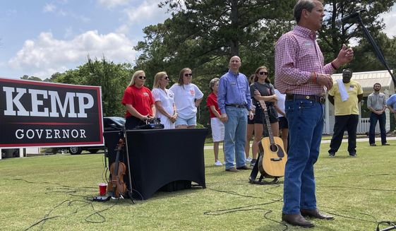 Georgia Gov. Brian Kemp speaks at a get-out-the-vote rally on Saturday, May 21, 2022, in Watkinsville, Ga.  Kemp is seeking to beat former U.S. Sen David Perdue and others in a Republican primary for governor on Tuesday, May 24. (AP Photo/Jeff Amy)
