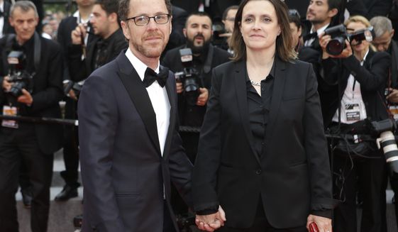 FILE - Ethan Coen, left, and Tricia Cooke at the 68th international film festival, Cannes, southern France, Saturday, May 23, 2015. Most in the film industry thought Ethan Coen was done with movies. Ethan did, too. But on Sunday, Coen will premiere his first documentary, &amp;quot;Jerry Lee Lewis: Trouble in Mind,&amp;quot; at the Cannes Film Festival. (AP Photo/Lionel Cironneau, File)