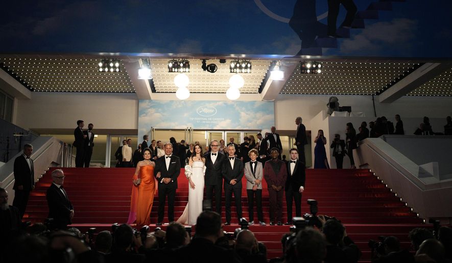 Tovah Feldshuh, left, Anne Hathaway, from third left, James Gray, Jeremy Strong, Michael Banks Repeta, Jaylin Webb, and Ryan Sell depart after the premiere of the film &#39;Armageddon Time&#39; at the 75th international film festival, Cannes, southern France, Thursday, May 19, 2022. (AP Photo/Daniel Cole)