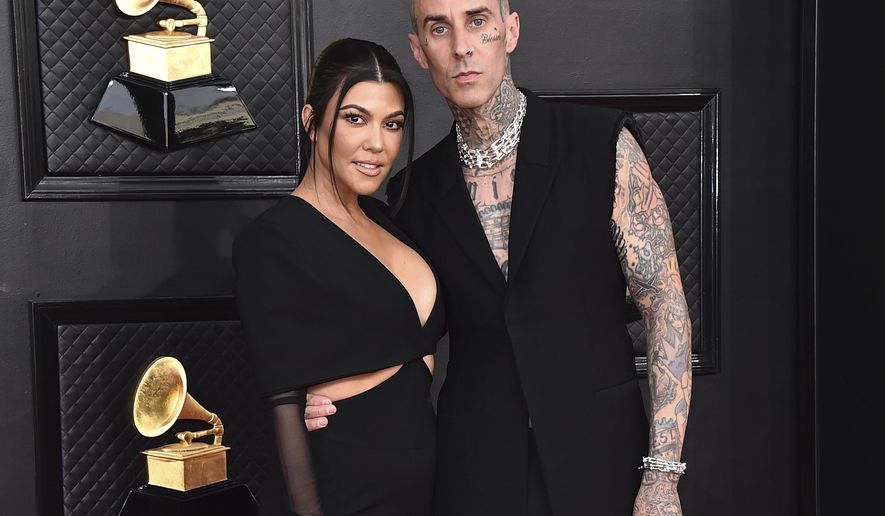 FILE - Kourtney Kardashian, left, and Travis Barker appear at the 64th Annual Grammy Awards in Las Vegas on April 3, 2022.   According to reports, Friday, May 20, Kardashian and Barker hit Portofino for a long wedding weekend.  (Photo by Jordan Strauss/Invision/AP, File)