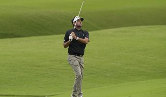 Bubba Watson hits from the fairway on the 16th hole during the third round of the PGA Championship golf tournament at Southern Hills Country Club, Saturday, May 21, 2022, in Tulsa, Okla. (AP Photo/Matt York)