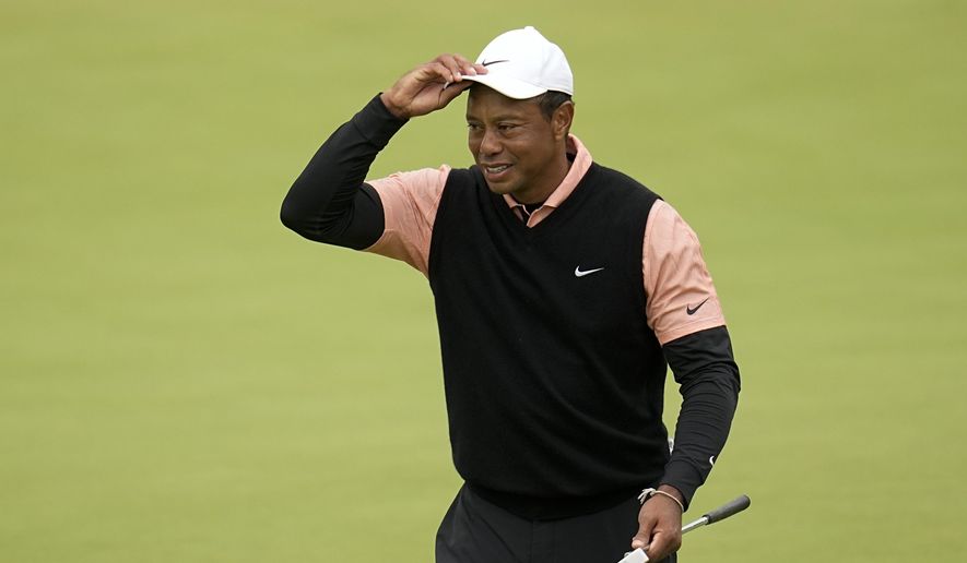 Tiger Woods walks on the green on the 18th hole during the third round of the PGA Championship golf tournament at Southern Hills Country Club, Saturday, May 21, 2022, in Tulsa, Okla. (AP Photo/Sue Ogrocki)