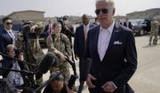 U.S. President Joe Biden, right, speaks before boarding Air Force One for a trip to Japan at Osan Air Base, Sunday, May 22, 2022, in Pyeongtaek, South Korea. (AP Photo/Evan Vucci)