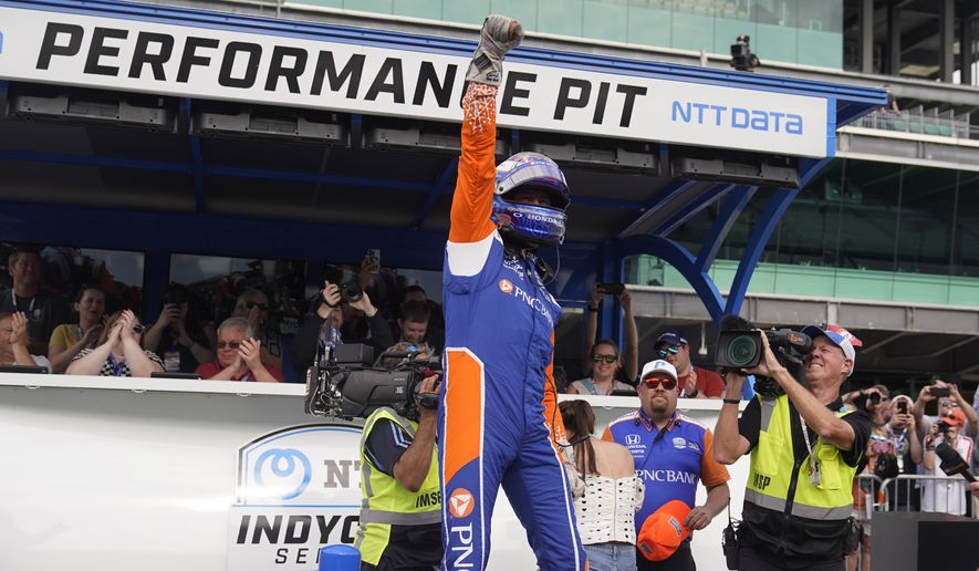 Scott Dixon, of New Zealand, celebrates after winning the pole during qualifications for the Indianapolis 500 auto race at Indianapolis Motor Speedway, Sunday, May 22, 2022, in Indianapolis. (AP Photo/Darron Cummings)