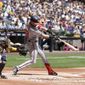 Washington Nationals&#39; Lane Thomas hits an RBI double during the second inning of a baseball game against the Milwaukee Brewers Sunday, May 22, 2022, in Milwaukee. (AP Photo/Morry Gash)