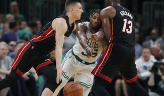 Miami Heat&#39;s Bam Adebayo (13) screens Boston Celtics&#39; Marcus Smart (36) as Tyler Herro, left, drives   during the second half of Game 3 of the NBA basketball Eastern Conference finals playoff series, Saturday, May 21, 2022, in Boston. (AP Photo/Michael Dwyer) **FILE**