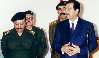 FILE - In this Tuesday, Feb. 11, 2003 file photo, Iraqi President Saddam Hussein meets with his leadership to mark the first day of Eid Al-Adha, the biggest feast of the Muslim calendar in Baghdad, Iraq. Tuesday, Feb. 11, 2003. From left to right are Vice President Taha Ramadan, Prime Minister Tariq Aziz, Presidential Secretary Abd Hmud. Iraq&#39;s Justice Ministry said Thursday, June 7, 2012 that a close aide to Saddam Hussein has been executed. Ministry spokesman Haider al-Saadi said Saddam&#39;s personal secretary was executed by hanging on Thursday. The personal secretary was identified as Abed Hamid Hmoud.  (AP Photo/INA, File)