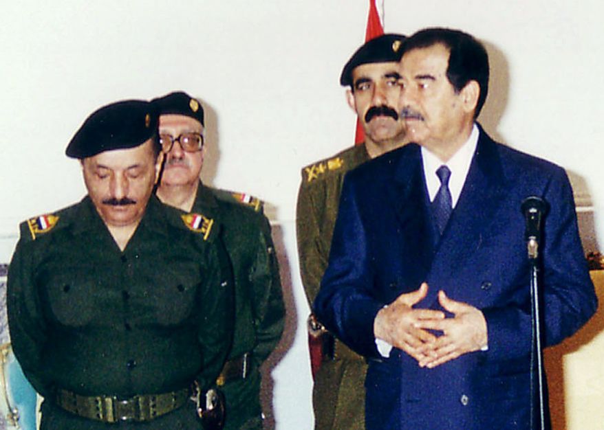 FILE - In this Tuesday, Feb. 11, 2003 file photo, Iraqi President Saddam Hussein meets with his leadership to mark the first day of Eid Al-Adha, the biggest feast of the Muslim calendar in Baghdad, Iraq. Tuesday, Feb. 11, 2003. From left to right are Vice President Taha Ramadan, Prime Minister Tariq Aziz, Presidential Secretary Abd Hmud. Iraq&#39;s Justice Ministry said Thursday, June 7, 2012 that a close aide to Saddam Hussein has been executed. Ministry spokesman Haider al-Saadi said Saddam&#39;s personal secretary was executed by hanging on Thursday. The personal secretary was identified as Abed Hamid Hmoud.  (AP Photo/INA, File)