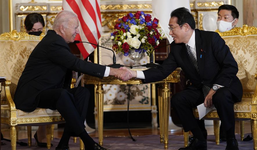 President Joe Biden shakes hands with Japanese Prime Minister Fumio Kishida during a bilateral meeting at Akasaka Palace, Monday, May 23, 2022, in Tokyo. (AP Photo/Evan Vucci)