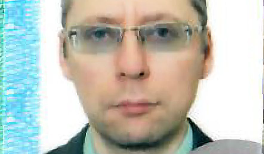 An image taken with permission from the passport photo page of Russian diplomat Boris Bondarev.  Bondarev, a veteran Russian diplomat to the U.N. Office at Geneva says he handed in his resignation before sending out a scathing letter on Monday May 23, 2022 to foreign colleagues inveighing against the aggressive war unleashed by President Vladimir Putin in Ukraine. (Boris Bondarev via AP)