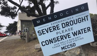 Signs alert visitors to the severe drought in Mendocino, Calif., on Wednesday, Aug. 4, 2021. California Gov. Gavin Newsom threatened Monday, May 23, 2022, to impose mandatory, statewide restrictions on water use if people don&#39;t start using less on their own as the drought drags on and the hotter summer months approach. (AP Photo/Haven Daley, File)