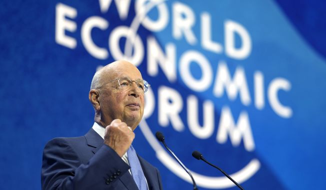 Klaus Schwab, President and founder of the World Economic Forum delivers his opening speech of the forum in Davos, Switzerland, Monday, May 23, 2022. The annual meeting of the World Economic Forum is taking place in Davos from May 22 until May 26, 2020. (AP Photo/Markus Schreiber)