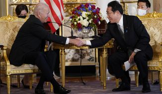 President Joe Biden shakes hands with Japanese Prime Minister Fumio Kishida during a bilateral meeting at Akasaka Palace, Monday, May 23, 2022, in Tokyo. (AP Photo/Evan Vucci)