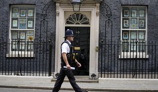 A police officer walks past 10 Downing Street in London, Monday, May 23, 2022. The general public waits for the release of Sue Gray&#39;s report into COVID lockdown breaches across Whitehall, the so called &amp;quot;Partygate&amp;quot;. (AP Photo/Frank Augstein)
