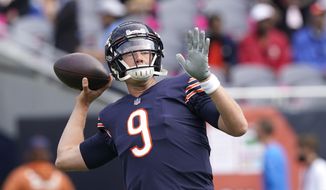 Chicago Bears quarterback Nick Foles warms up before an NFL football game against the Detroit Lions, Sunday, Oct. 3, 2021, in Chicago. The Indianapolis Colts signed free agent quarterback Foles to a two-year deal on Monday, May 23, 2022, to back up Matt Ryan. (AP Photo/Nam Y. Huh, File) **FILE**