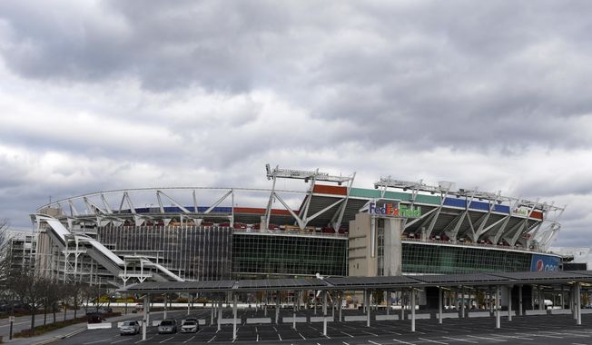 FedEx Field is seen in this general view prior to an NFL football game between the Seattle Seahawks and the Washington Football Team, Monday, Nov. 29, 2021, in Landover, Md. A person with knowledge of the situation tells The Associated Press the Washington Commanders have bought land in Virginia for what could be a potential site of the NFL team’s next stadium. The 200 acres of land purchased for approximately $100 million is in Woodbridge roughly 25 miles outside the District of Columbia. The Commanders’ lease at FedEx Field in Landover, Maryland, expires in 2027. (AP Photo/Mark Tenally, File)