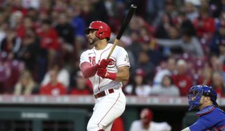 Cincinnati Reds&#39; Tommy Pham, left, watches his home run in front of Chicago Cubs catcher Yan Gomes during the sixth inning of a baseball game in Cincinnati, Monday, May 23, 2022. (AP Photo/Paul Vernon) **FILE**