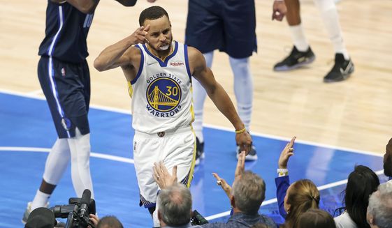 Golden State Warriors&#39; Stephen Curry celebrates a basket and a Dallas Mavericks&#39; foul during the first half of Game 3 of the NBA basketball playoffs Western Conference finals, Sunday, May 22, 2022, in Dallas. (Scott Strazzante/San Francisco Chronicle via AP) **FILE**