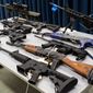 Weapons are displayed during a news conference in Los Angeles on Feb. 22, 2022, after state and regional law enforcement seized 114 guns from people legally prohibited from owning firearms during a five-day sweep across 51 cities in the Los Angeles area. Spurred by the Tuesday, May 24, 2022, deadly elementary school shooting in Texas, California senators approved giving citizens the power to sue those who traffic in illegal firearms, mimicking a Texas law that is intended to deter abortions. (Eric Licas/The Orange County Register via AP, File)