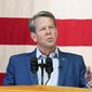 Georgia Gov. Brian Kemp speaks during a Get Out the Vote Rally, on May 23, 2022, in Kennesaw, Ga. After incumbent Kemp refused to accept former President Donald Trump&#39;s baseless claims of widespread voter fraud in Georgia, he sought retribution by personally recruiting former Republican Sen. David Perdue to mount a primary challenge. (AP Photo/Brynn Anderson, File)