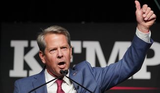 Republican Gov. Brian Kemp waves to supporters during an election night watch party, Tuesday, May 24, 2022, in Atlanta. Kemp easily turned back a GOP primary challenge Tuesday from former U.S. Sen. David Perdue, who was backed by former President Donald Trump. (AP Photo/John Bazemore)