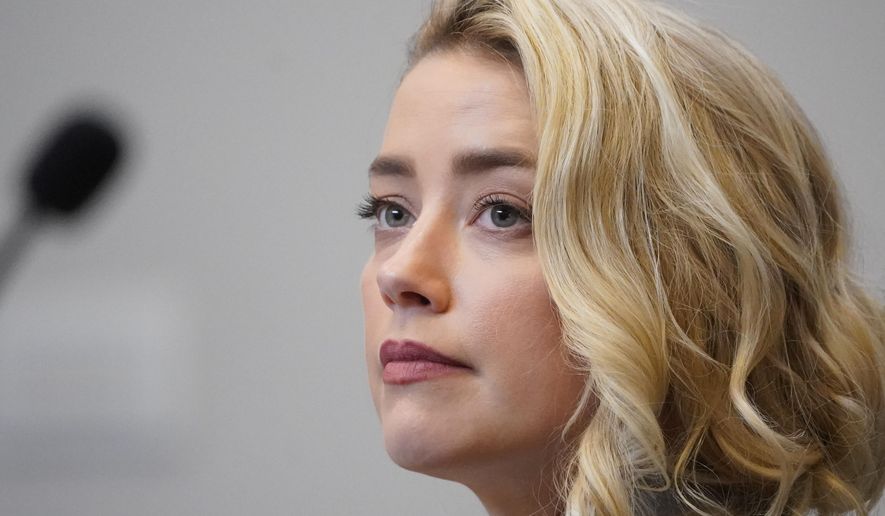 Actor Amber Heard listens in the courtroom at the Fairfax County Circuit Courthouse in Fairfax, Va., Monday, May 23, 2022. Actor Johnny Depp sued his ex-wife Amber Heard for libel in Fairfax County Circuit Court after she wrote an op-ed piece in The Washington Post in 2018 referring to herself as a &amp;quot;public figure representing domestic abuse.&amp;quot; (AP Photo/Steve Helber, Pool)