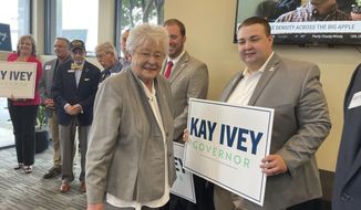 Alabama Gov. Kay Ivey greets supporters including Logan Glass, right, and Kyle Lewter, during a campaign stop on Monday, May 23, 2022 in Huntsville Ala. Ivey faces several challengers in the May 24, 2022 primary. (AP Photo/Kim Chandler)