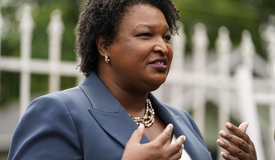Georgia Democratic gubernatorial candidate Stacey Abrams talks to the media during Georgia&#39;s primary election on Tuesday, May 24, 2022, in Atlanta. (AP Photo/Brynn Anderson)