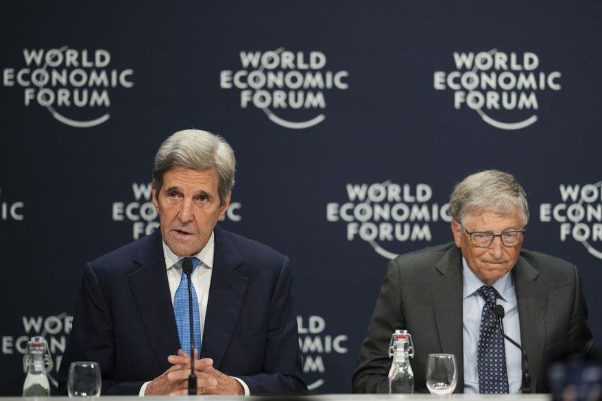 John Kerry, left, United States Special Presidential Envoy for Climate and Bill Gates, Co-Chair, Bill & Melinda Gates Foundation, attend a news conference during the World Economic Forum in Davos, Switzerland, Wednesday, May 25, 2022. The annual meeting of the World Economic Forum is taking place in Davos from May 22 until May 26, 2022. (AP Photo/Markus Schreiber)